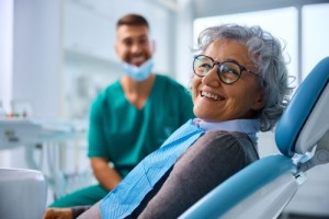 Woman at implant denture in Covallis exam